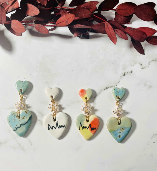 Love me now earrings.