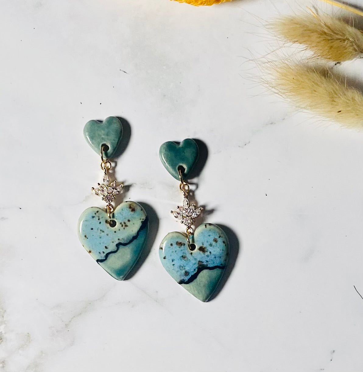 Love me now earrings.