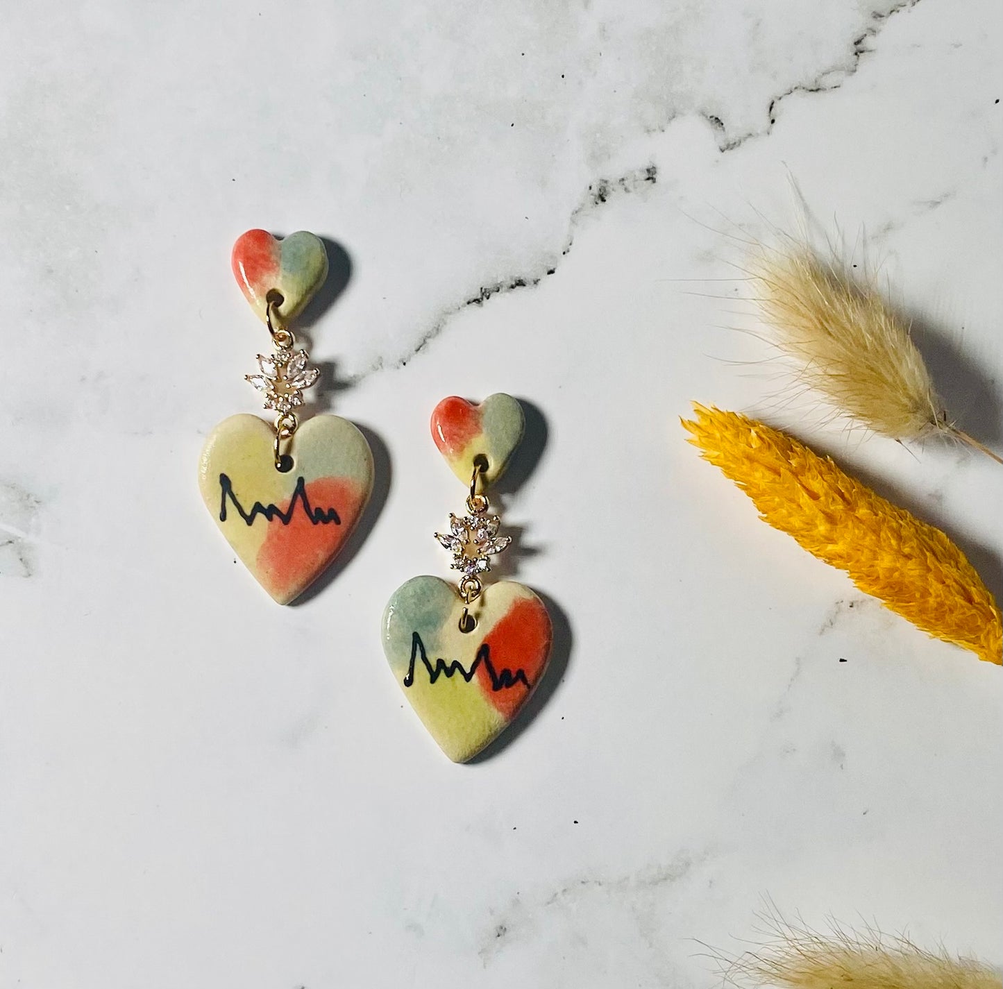 Love me now earrings.