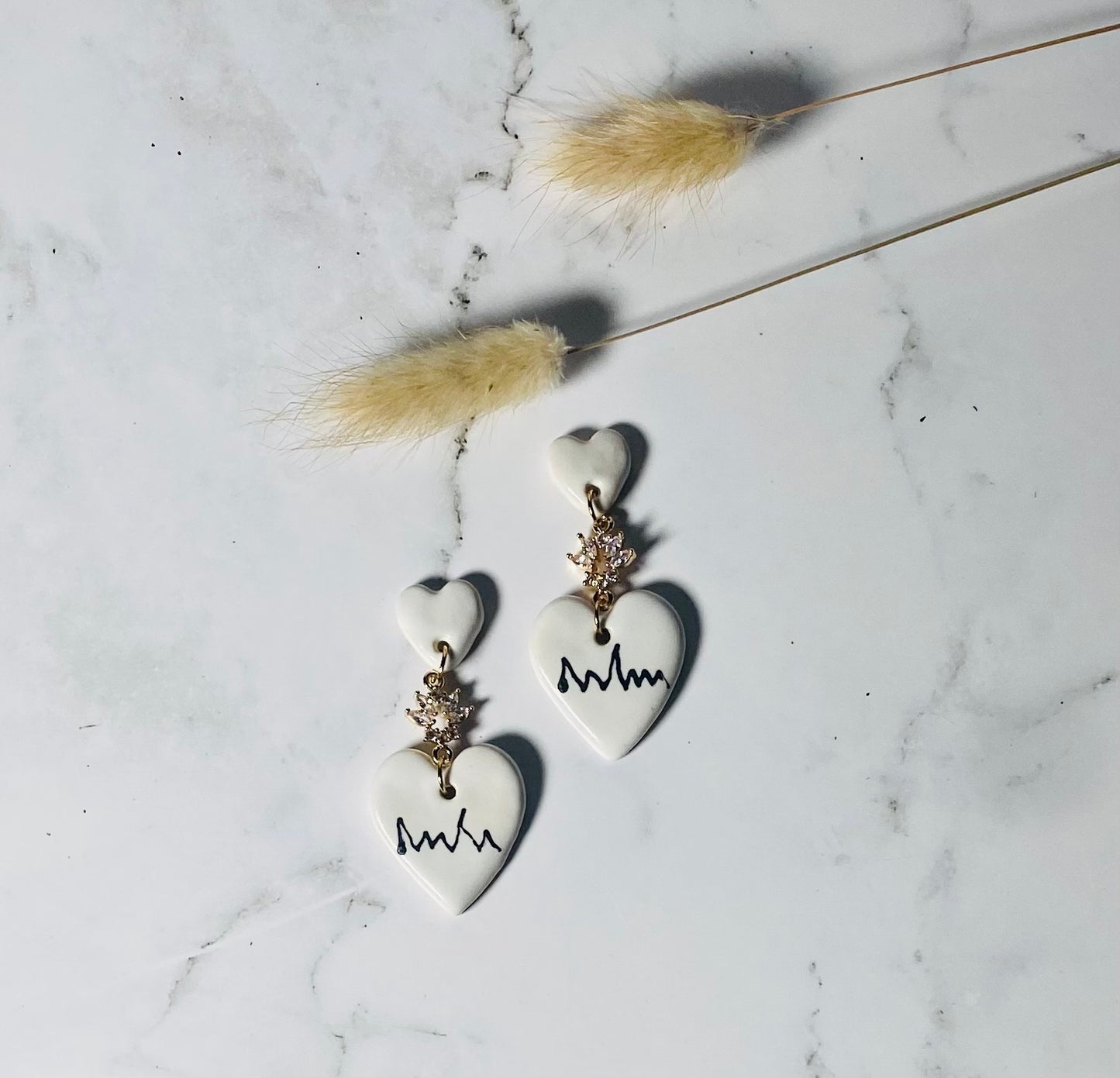 Love me now earrings.